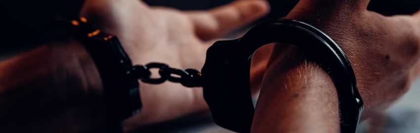 A pair of hands in handcuffs, emphasising the importance of a private criminal defence solicitor